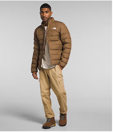 Man in brown down jacket. hand in pocket.